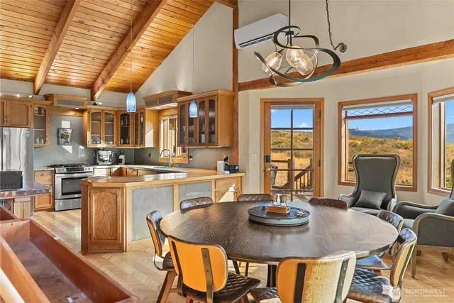 a view of a dining room with furniture wooden floor and chandelier