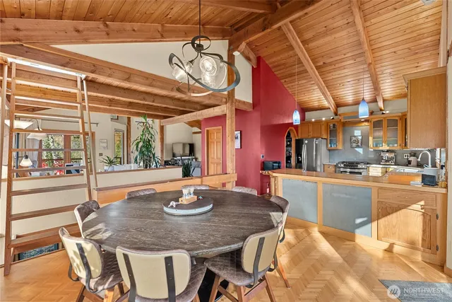 a dining room with a table and chairs