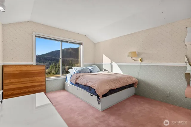 a bedroom with a bed and window