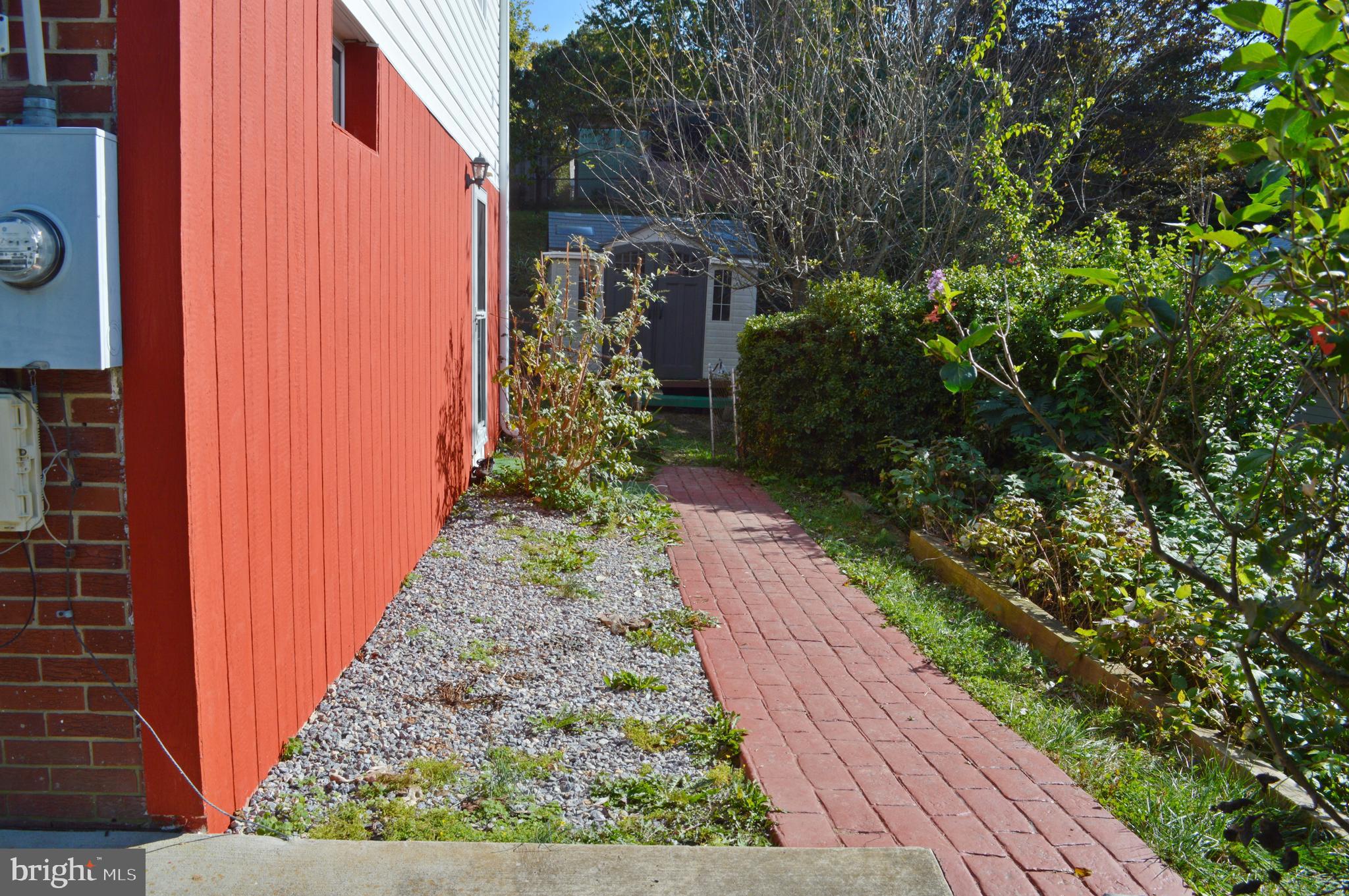 5953 Kedron Street Springfield, VA 22150 - Photo 26 of 28 a view of a pathway with house on both side