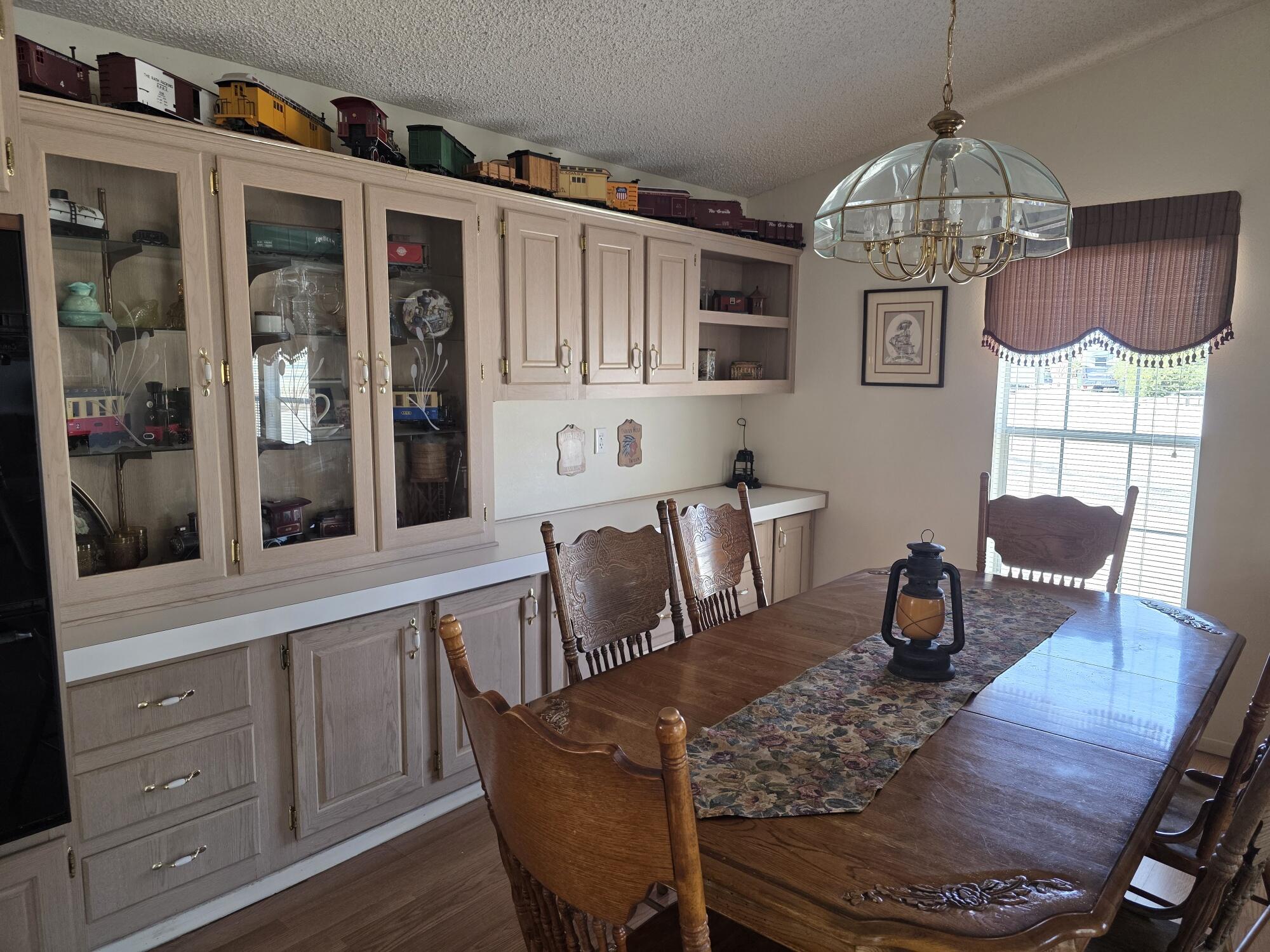 10595 Hot Mineral Spa Road, Unit 195 Niland, CA 92257 - Photo 12 of 32 a view of a dining room with furniture window and wooden floor