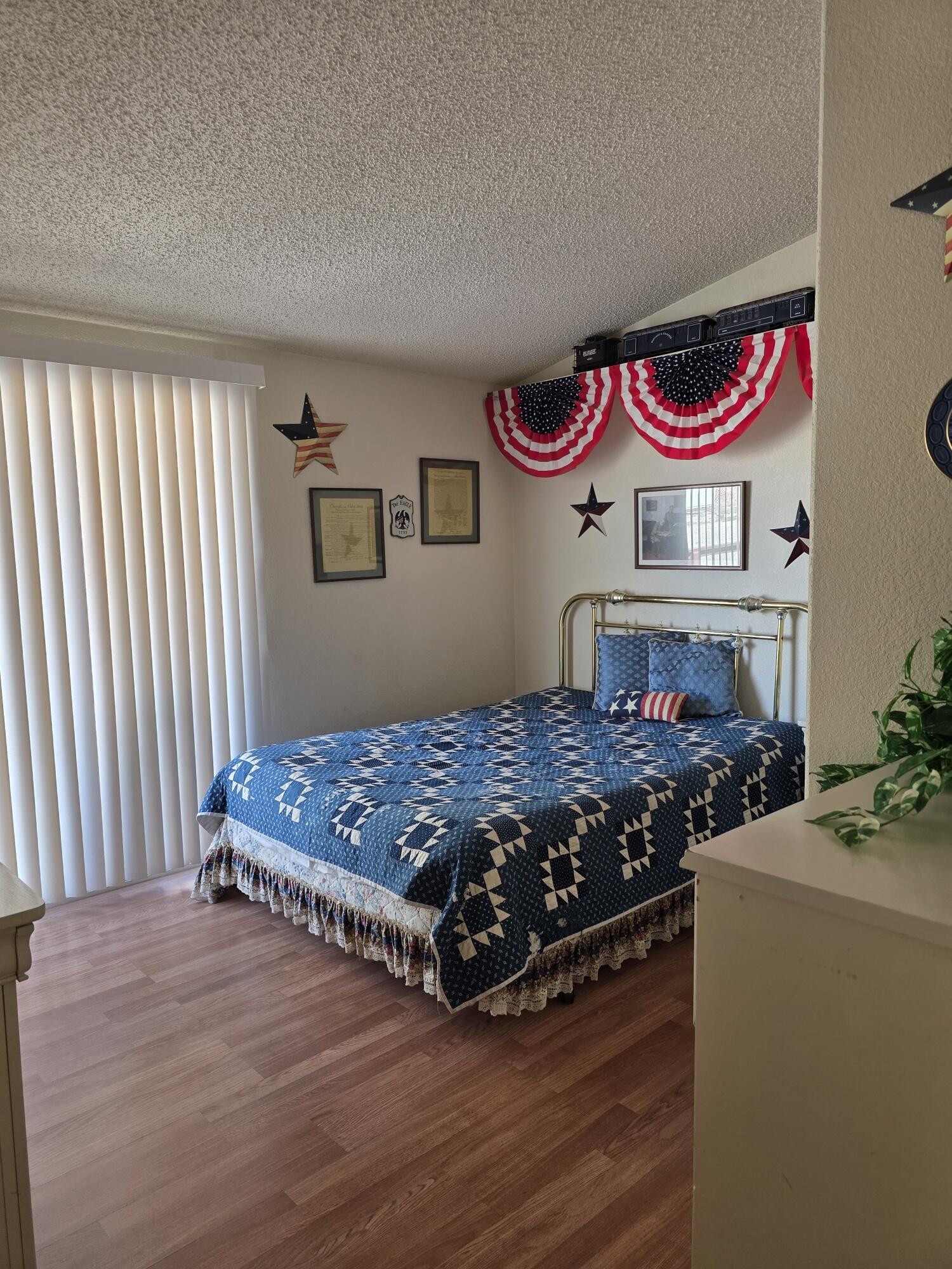 10595 Hot Mineral Spa Road, Unit 195 Niland, CA 92257 - Photo 16 of 32 a bedroom with a bed and a dresser