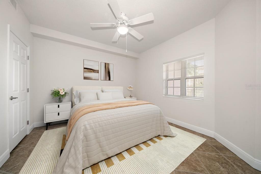 7069 Key Haven Road, Unit 304 Seminole, FL 33777 - Photo 14 of 50 a bedroom with a bed and a window