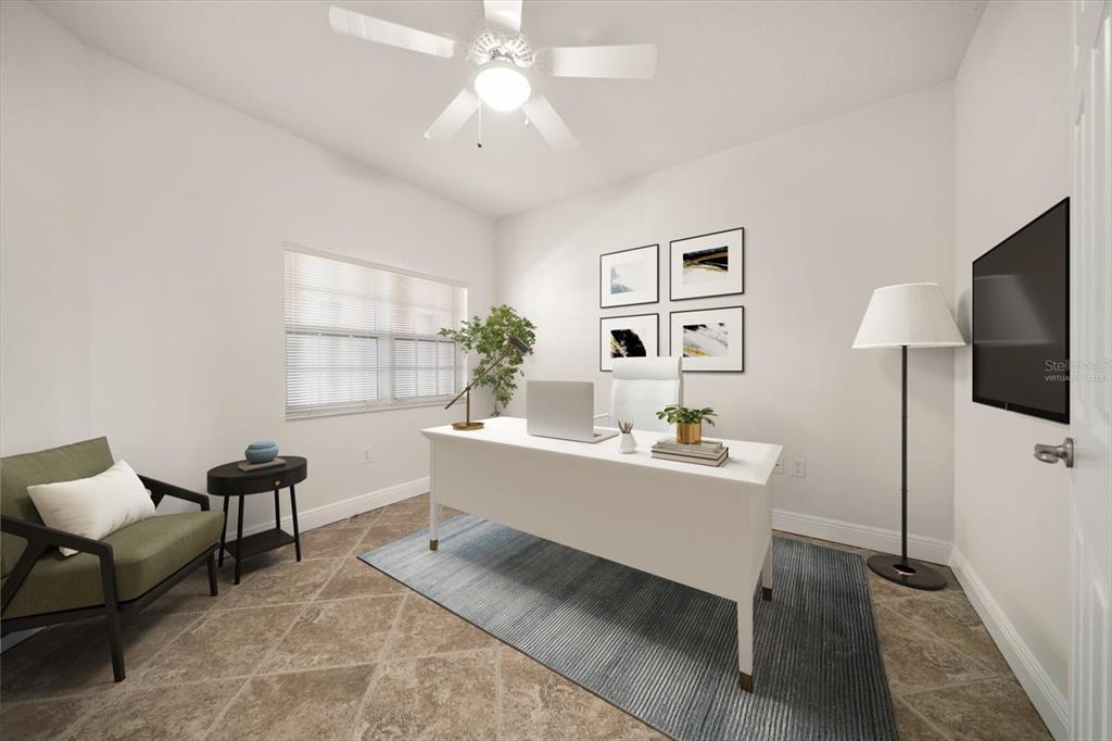 7069 Key Haven Road, Unit 304 Seminole, FL 33777 - Photo 15 of 50 a living room with furniture and a flat screen tv