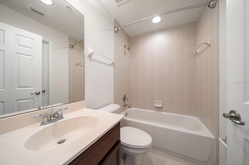 7069 Key Haven Road, Unit 304 Seminole, FL 33777 - Photo 16 of 50 a bathroom with a sink toilet and shower