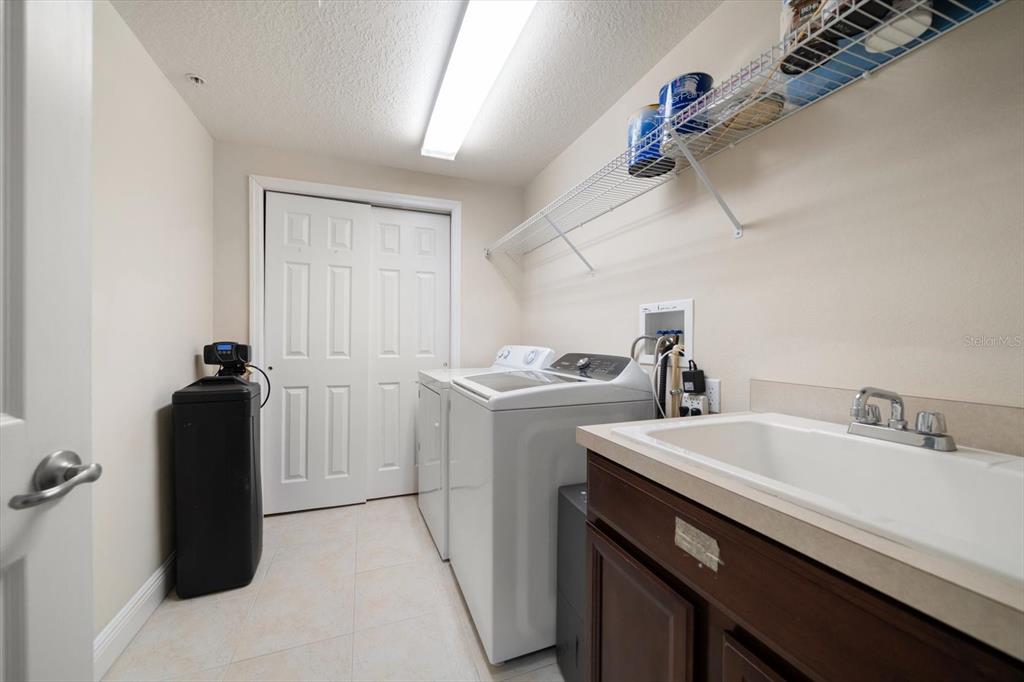 7069 Key Haven Road, Unit 304 Seminole, FL 33777 - Photo 17 of 50 a utility room with dryer and washer