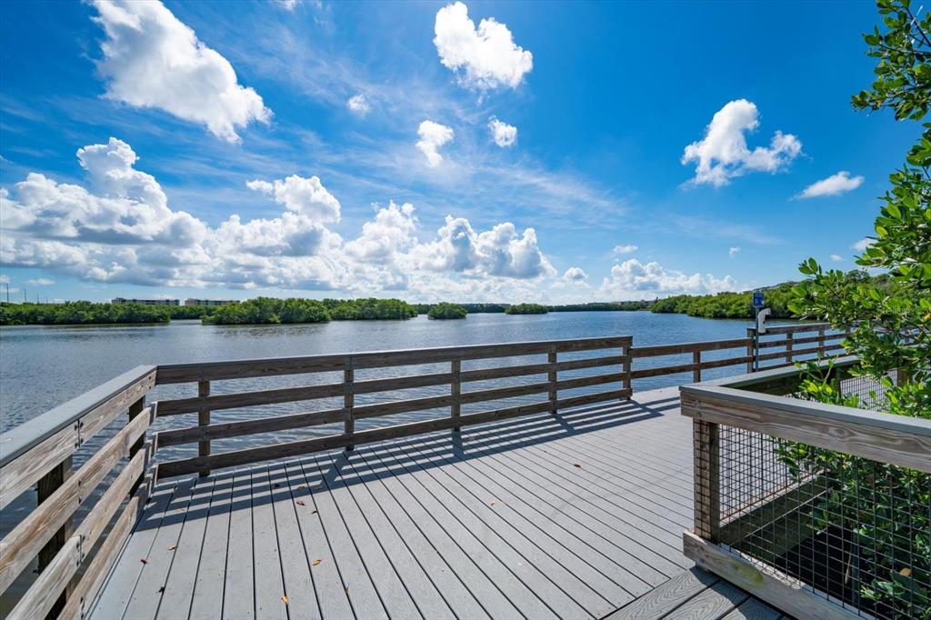 7069 Key Haven Road, Unit 304 Seminole, FL 33777 - Photo 19 of 50 a view of a balcony with wooden floor