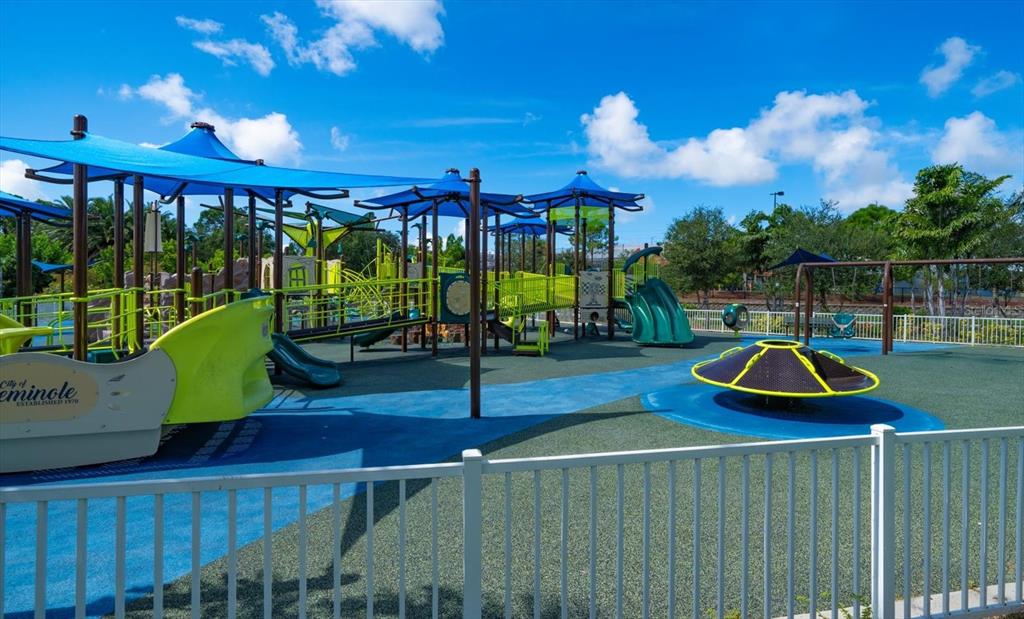 7069 Key Haven Road, Unit 304 Seminole, FL 33777 - Photo 28 of 50 a view of a swimming pool with a patio
