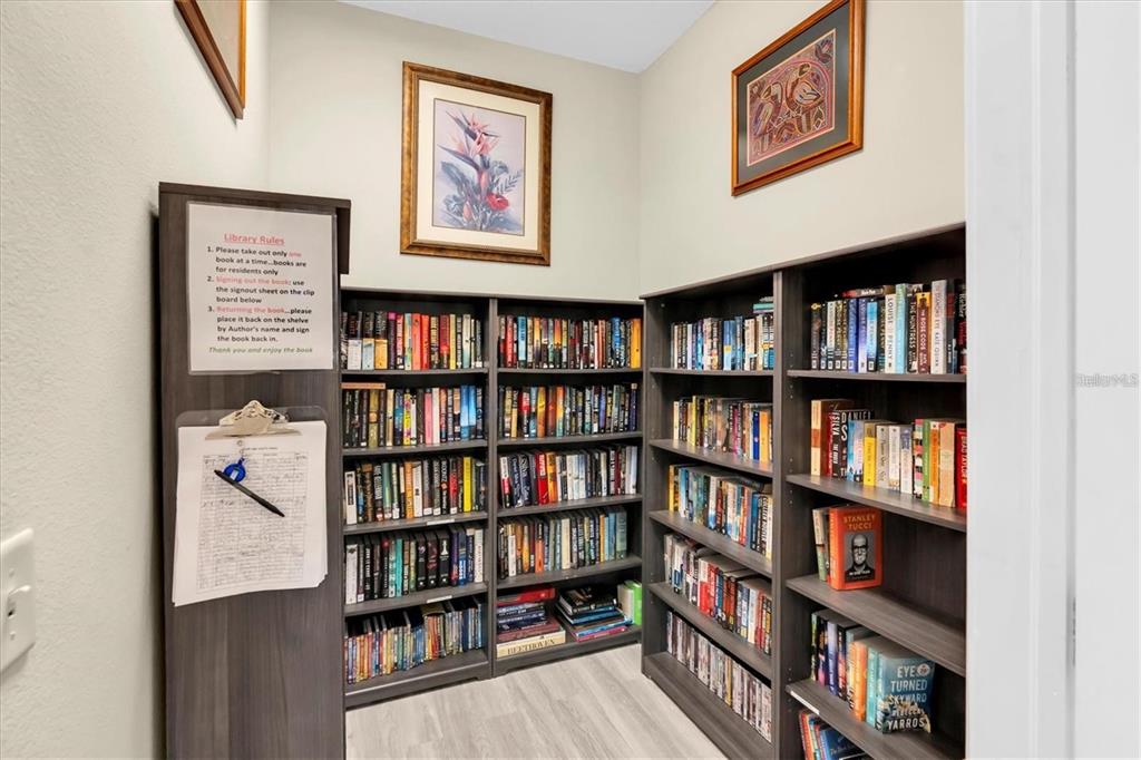 7069 Key Haven Road, Unit 304 Seminole, FL 33777 - Photo 33 of 50 a view of a book shelf with books