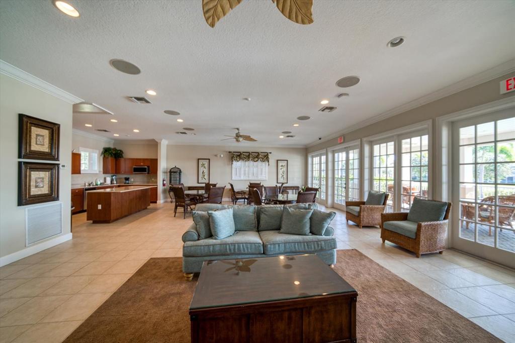 7069 Key Haven Road, Unit 304 Seminole, FL 33777 - Photo 34 of 50 a living room with furniture and a large window