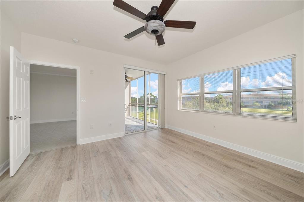 7069 Key Haven Road, Unit 304 Seminole, FL 33777 - Photo 41 of 50 a view of an empty room with a window and wooden floor