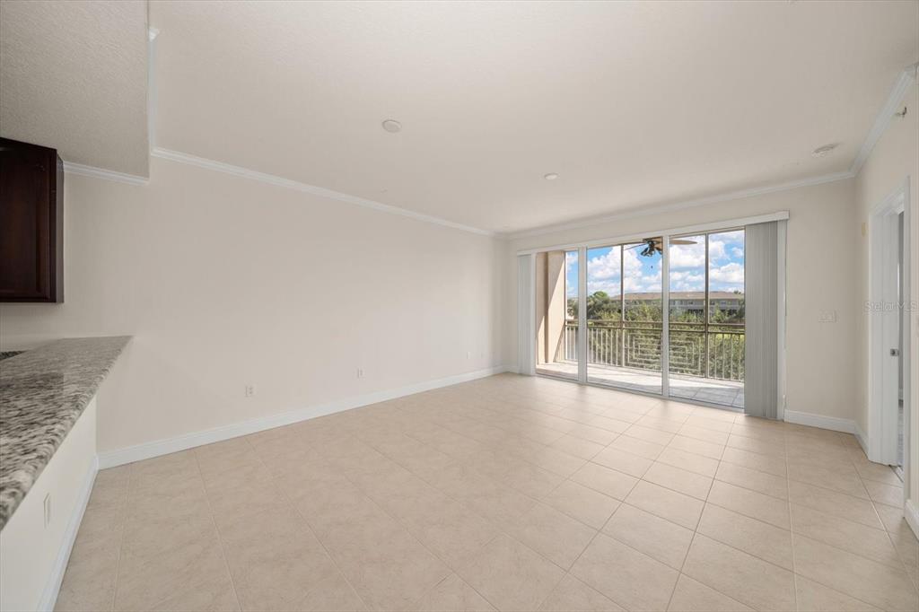 7069 Key Haven Road, Unit 304 Seminole, FL 33777 - Photo 43 of 50 a view of an empty room with a window