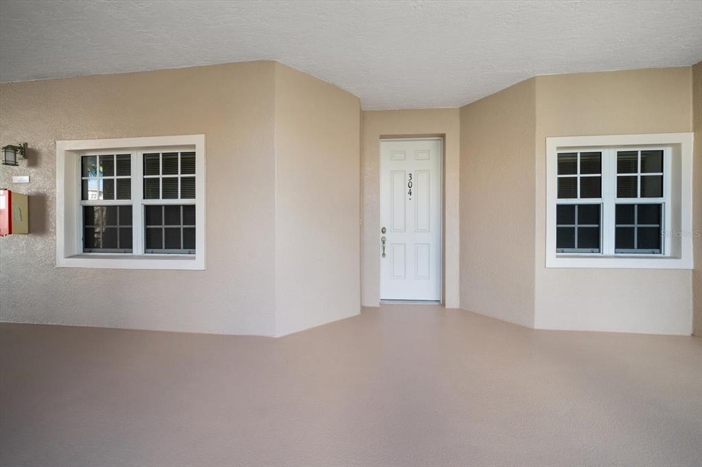 7069 Key Haven Road, Unit 304 Seminole, FL 33777 - Photo 48 of 50 a view of empty room with windows