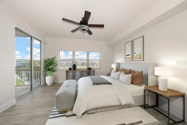 a bedroom with a large bed and a window