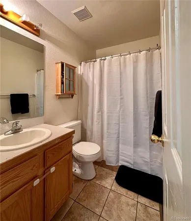 a bedroom with bed and a window