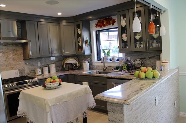 a kitchen with a sink and cabinets
