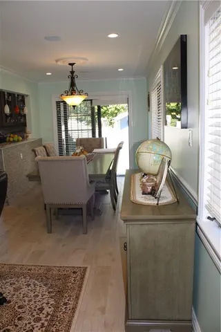 a living room with furniture a window and a dining table