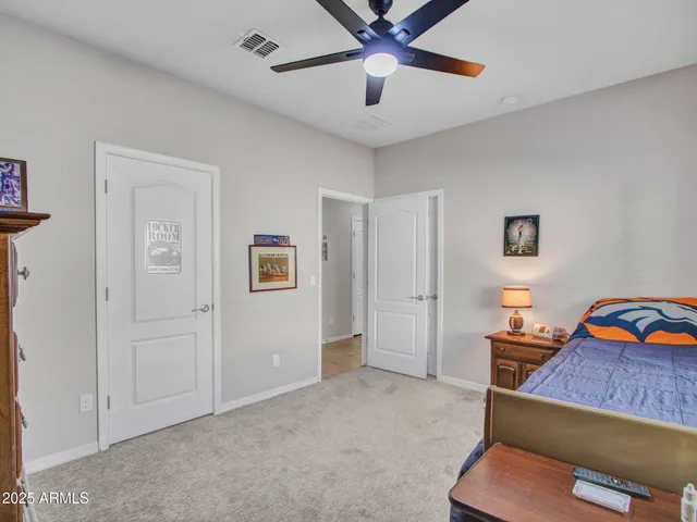 a bedroom with bed and window