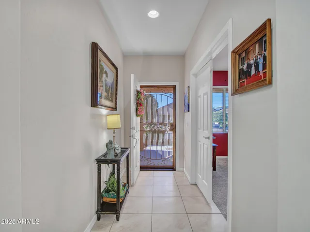 a view of a brick house with large windows