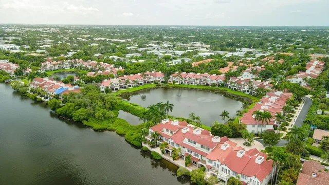 an aerial view of city and lake