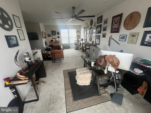 a bedroom with a bed and a flat tv screen