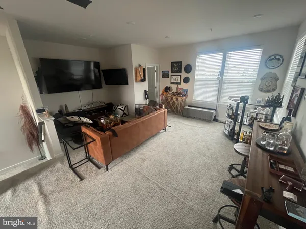 a bedroom with a bed and a mirror