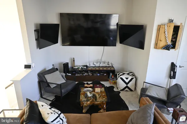 a reading room with furniture and air hockey table