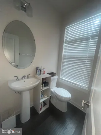 a view of a house with a wooden fence