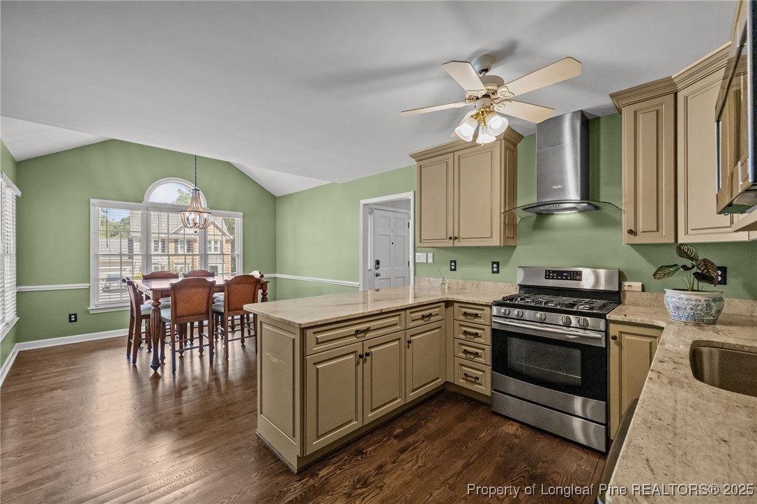 5302 Middleton Road Durham, NC 27713 - Photo 12 of 40 a kitchen with a stove cabinets and chairs