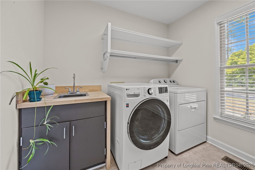 5302 Middleton Road Durham, NC 27713 - Photo 15 of 40 a utility room with dryer and washer