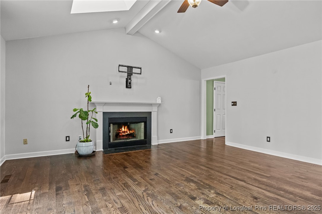 5302 Middleton Road Durham, NC 27713 - Photo 17 of 40 an empty room with wooden floor fireplace and window