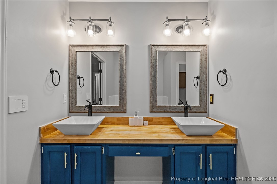 5302 Middleton Road Durham, NC 27713 - Photo 24 of 40 a bathroom with a sink and a mirror