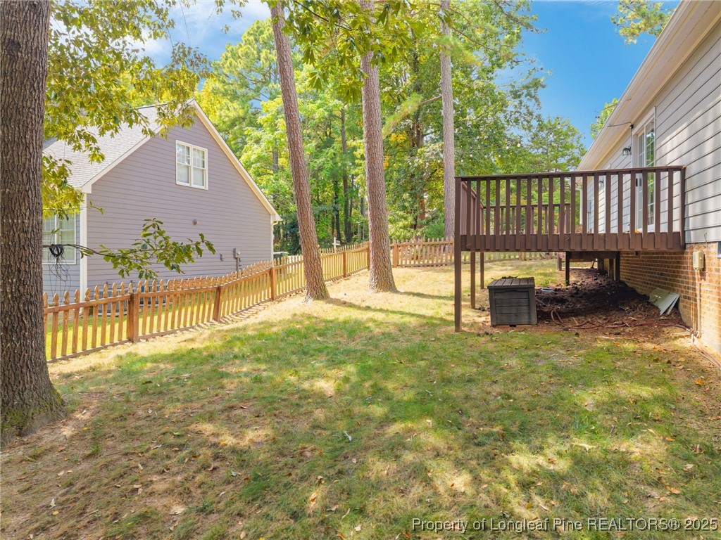 5302 Middleton Road Durham, NC 27713 - Photo 36 of 40 a view of backyard with a garden and deck