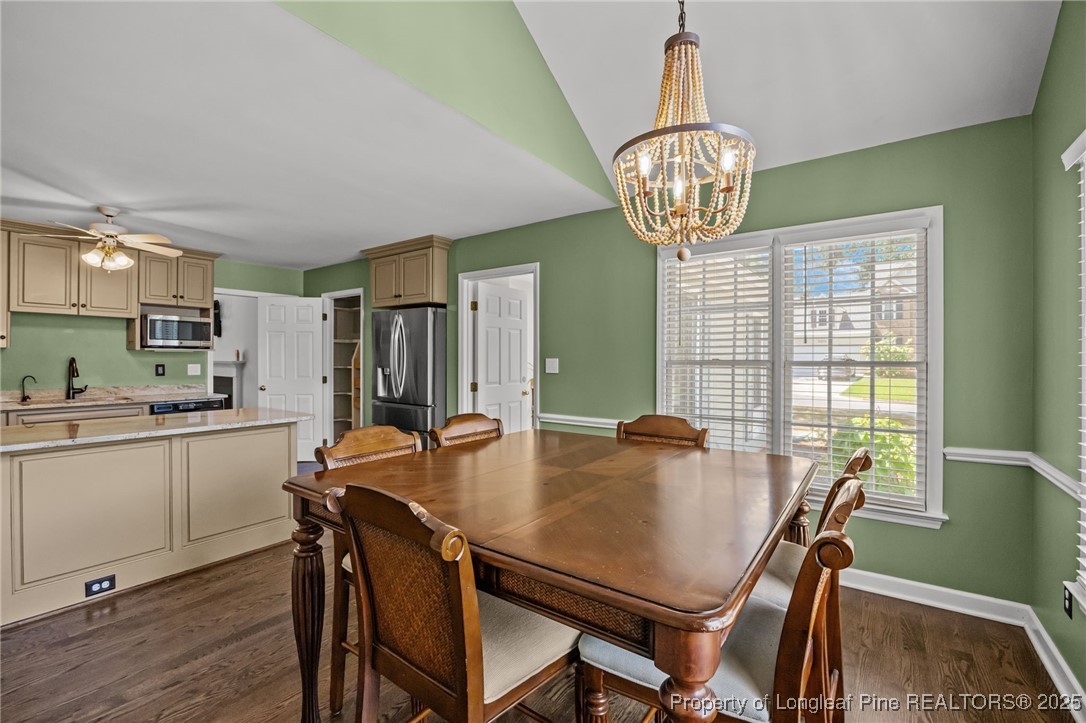 5302 Middleton Road Durham, NC 27713 - Photo 10 of 40 a view of a dining room with furniture window and wooden floor