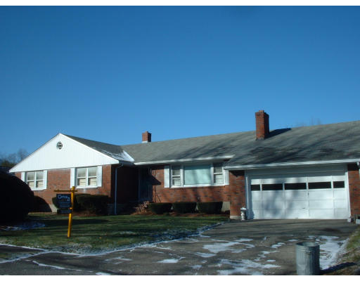 7 Slocum Road Lexington, MA 02421 - Photo 1 of 6 a front view of a house with garden