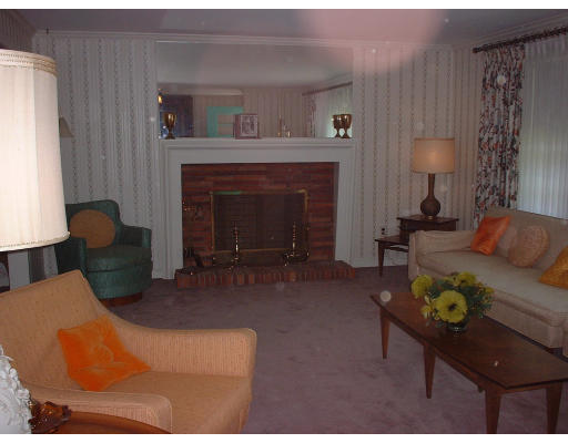 7 Slocum Road Lexington, MA 02421 - Photo 4 of 6 a living room with furniture and a fireplace