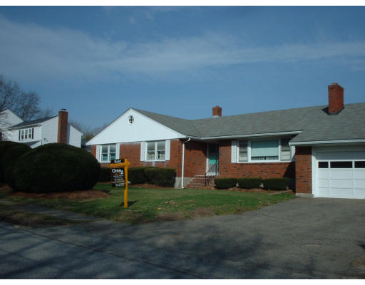 7 Slocum Road Lexington, MA 02421 - Photo 6 of 6 a front view of a house with a yard and garage