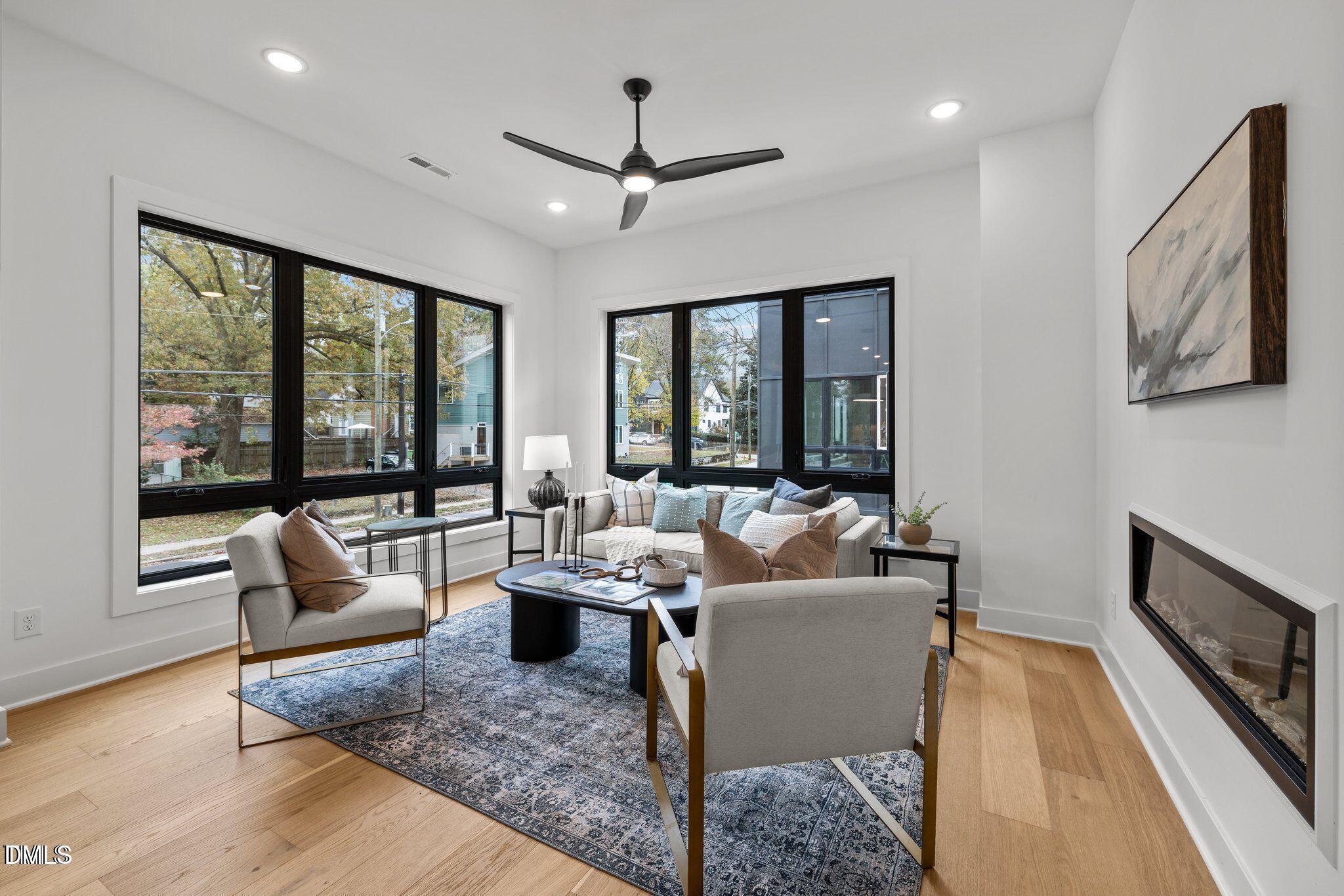 517 Edgecreek Court Raleigh, NC 27604 - Photo 7 of 25 a living room with furniture and large windows