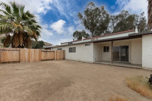 a view of a backyard of the house