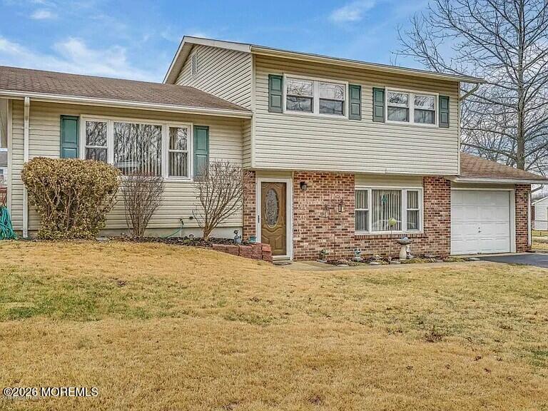 1004 Woodlane Road Jackson, NJ 08527 - Photo 1 of 10 front view of a house with a yard