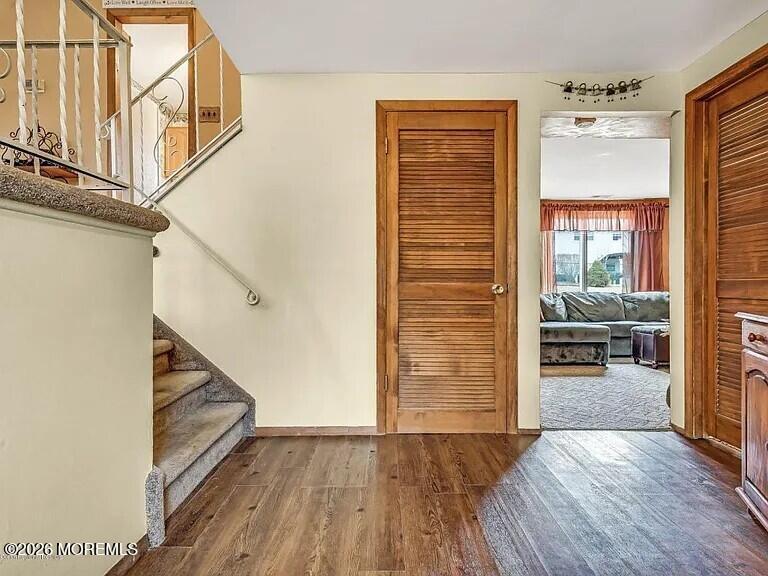 1004 Woodlane Road Jackson, NJ 08527 - Photo 2 of 10 a view of a livingroom with wooden floor and stairs