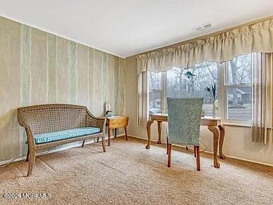 1004 Woodlane Road Jackson, NJ 08527 - Photo 6 of 10 a bedroom with a bed and a chandelier
