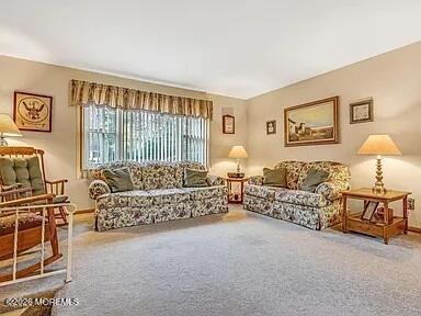 1004 Woodlane Road Jackson, NJ 08527 - Photo 7 of 10 a bed room with furniture and a window