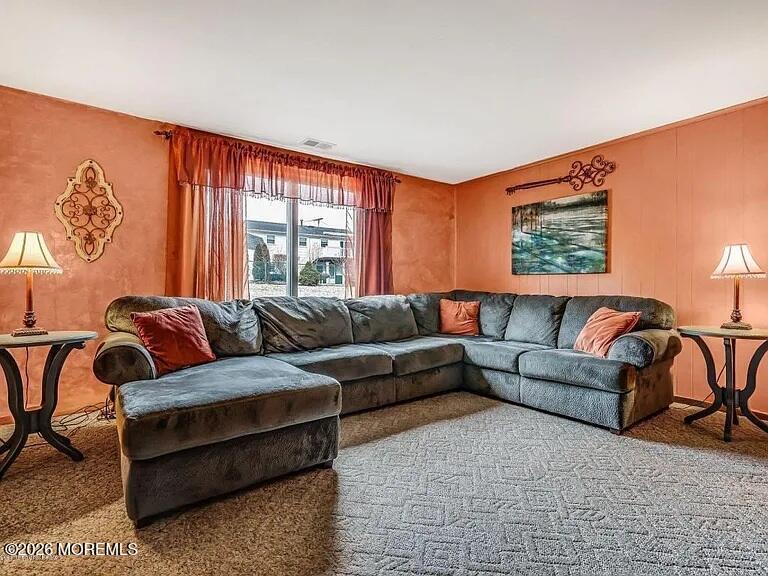 1004 Woodlane Road Jackson, NJ 08527 - Photo 8 of 10 a living room with furniture and a window