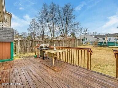 1004 Woodlane Road Jackson, NJ 08527 - Photo 9 of 10 a view of a balcony with wooden floor and iron fence