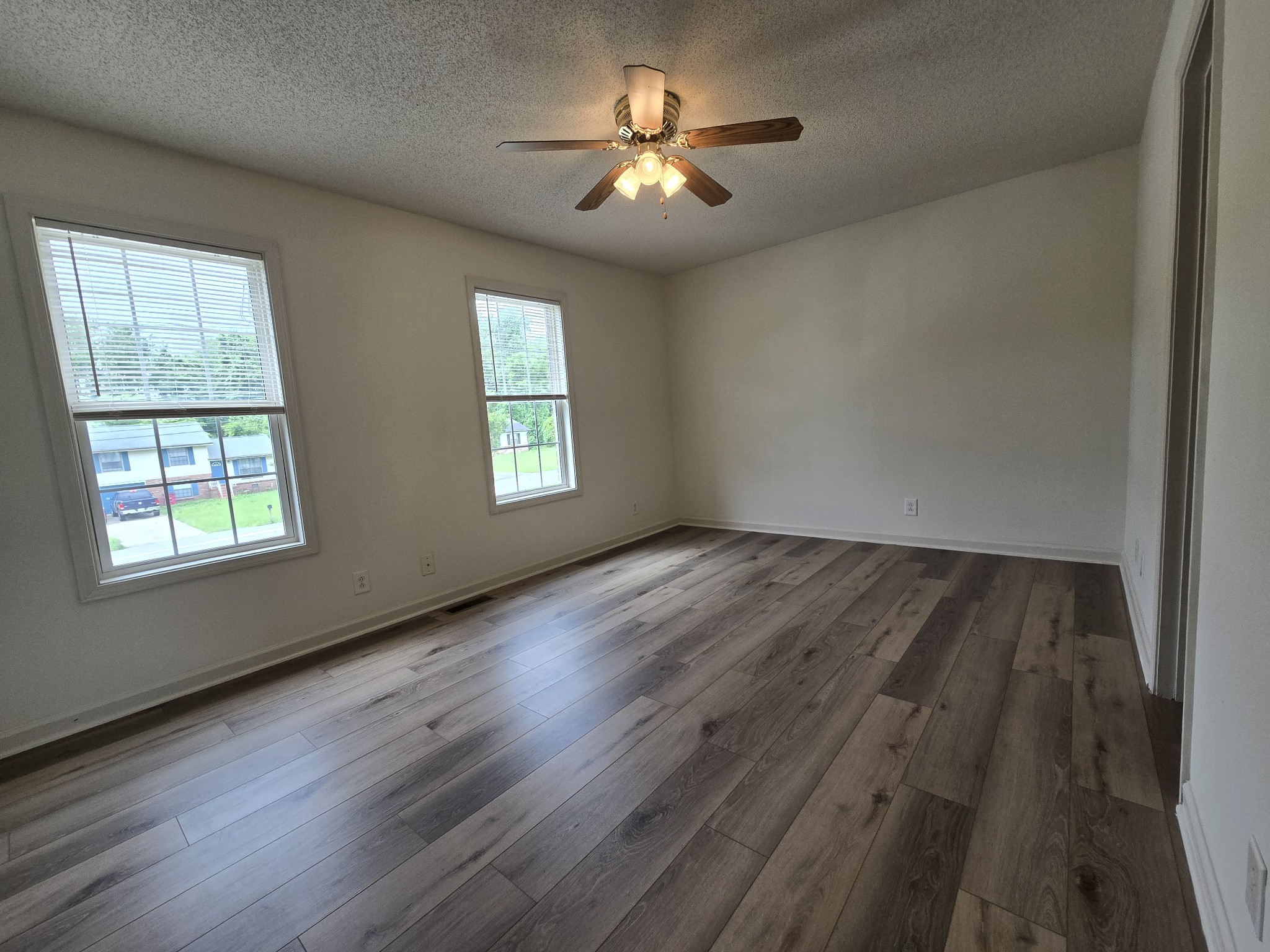 237 State Line Road Oak Grove, KY 42262 - Photo 14 of 20 a view of empty room with wooden floor and fan