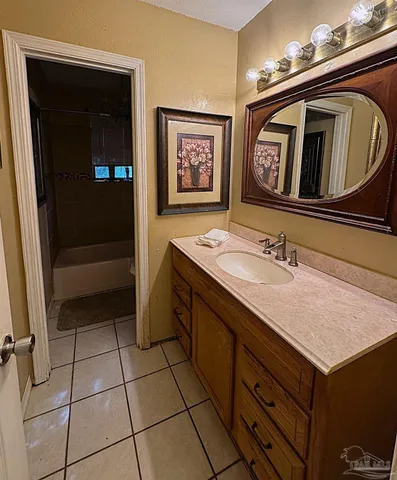 a bathroom with a sink a vanity and a mirror