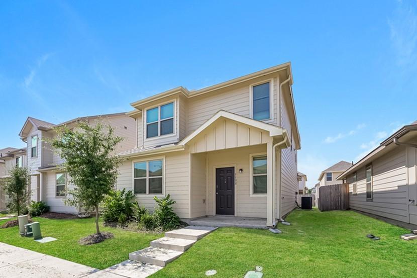 front view of a house with a yard