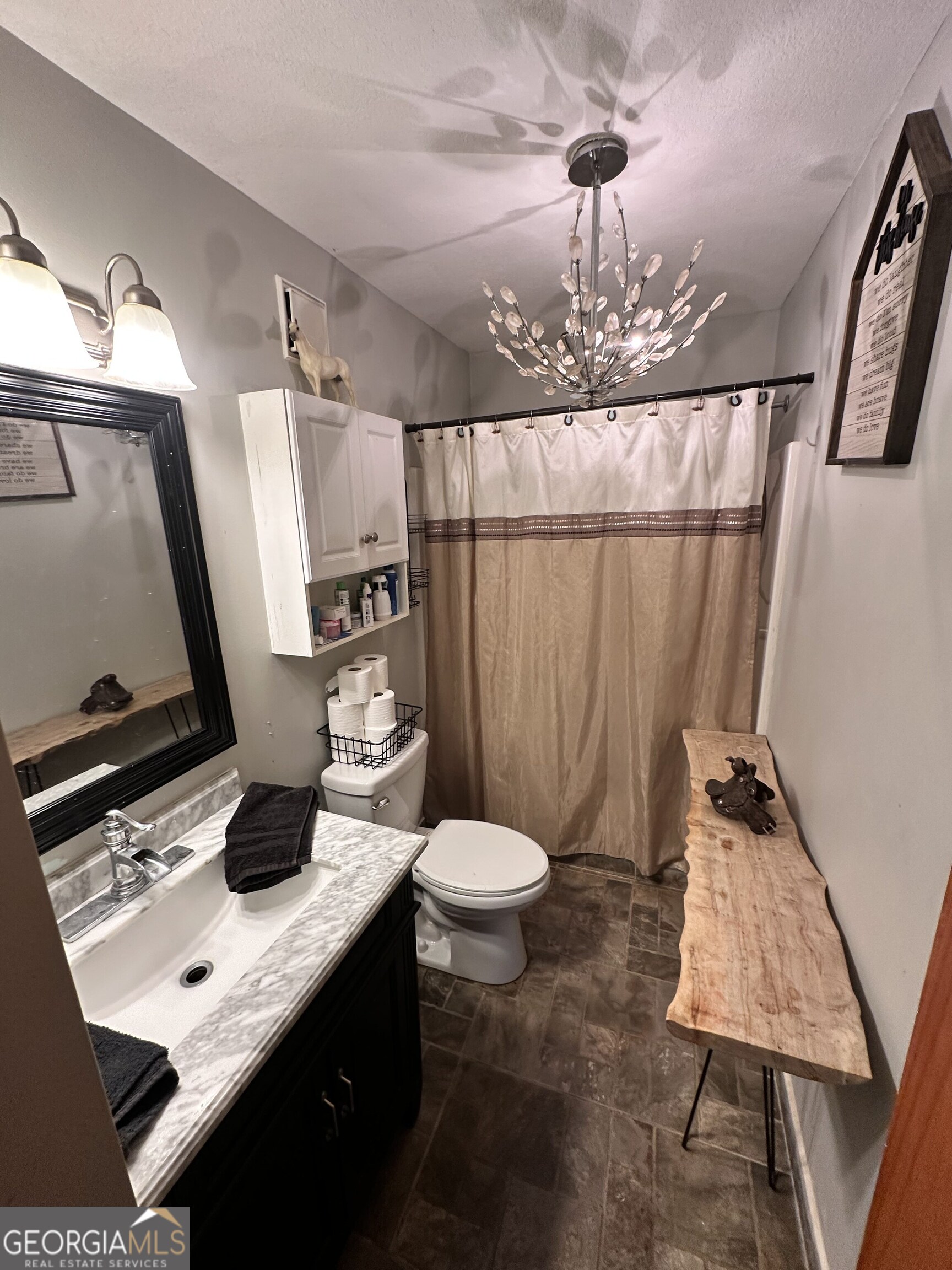 2015 Highway 59 Commerce, GA 30529 - Photo 9 of 27 a bathroom with a sink a toilet and mirror