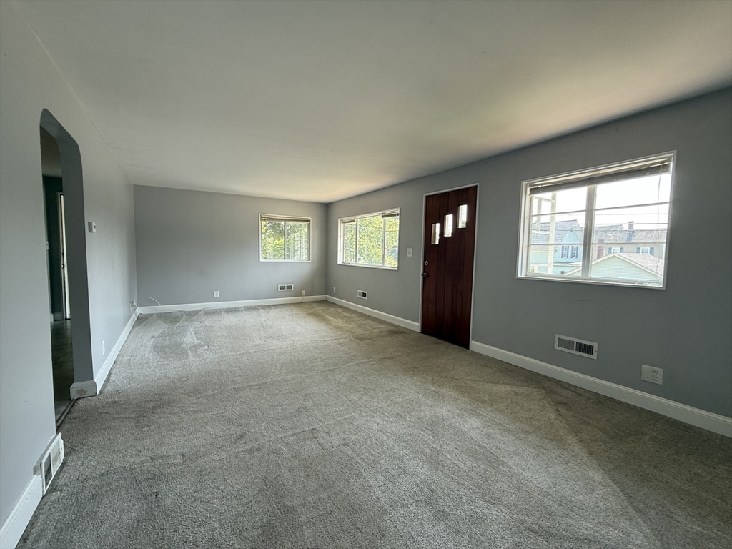 36 5th Avenue Lowell, MA 01854 - Photo 8 of 16 an empty room with windows